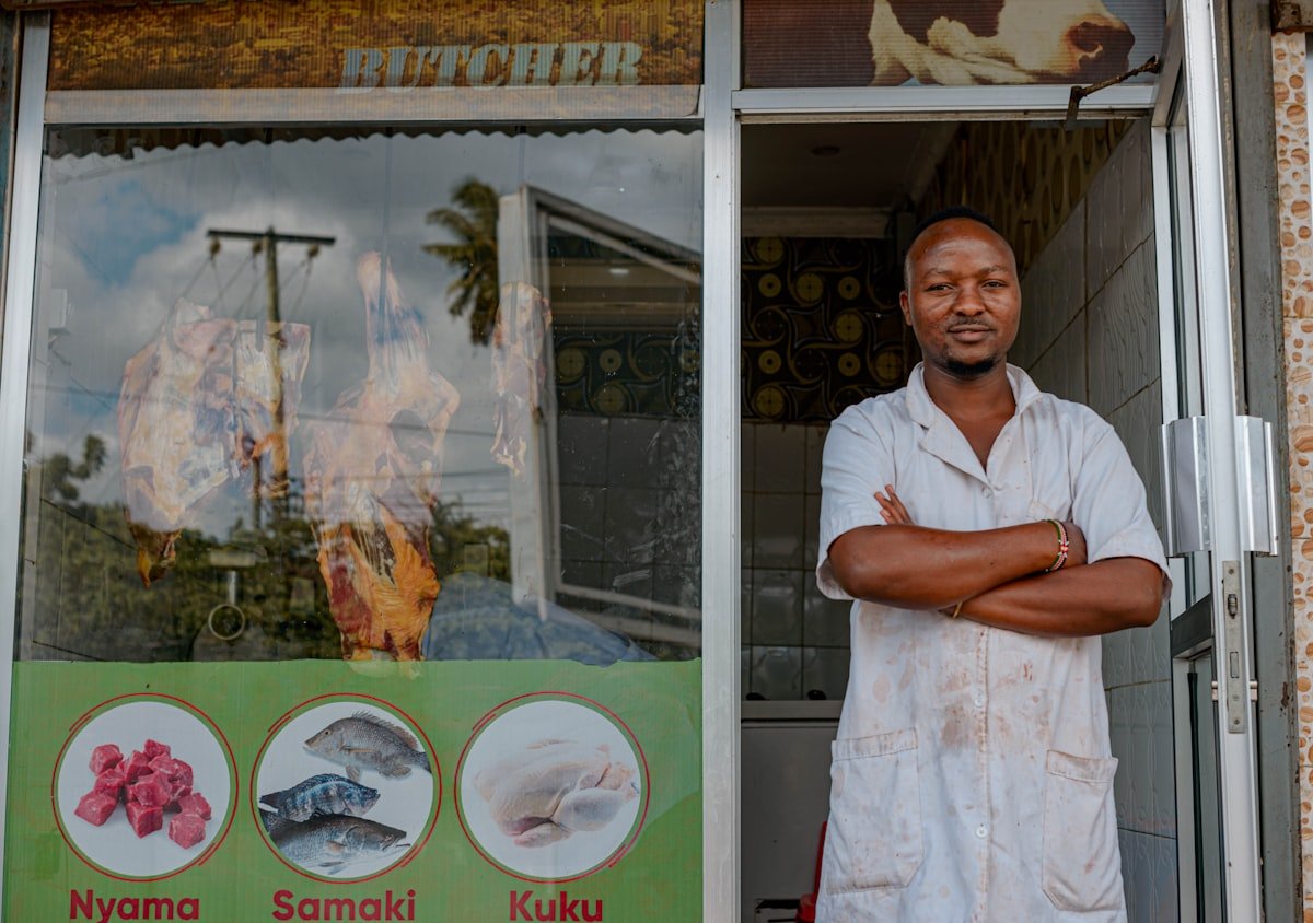 Shop owner outside store